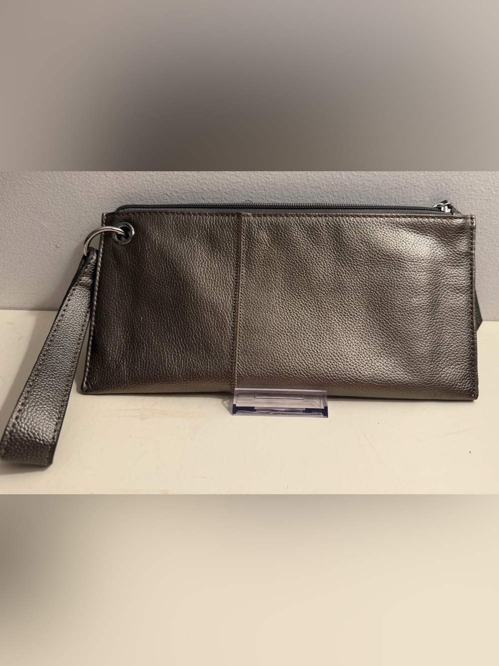 Leather grey/silver oversized leather wristlet.